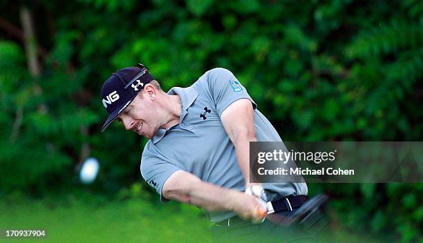 Hunter Mahan hits his drive on the 12th hole during the first round of the Travelers Championship held at TPC River Highlands on June 20, 2013 in...