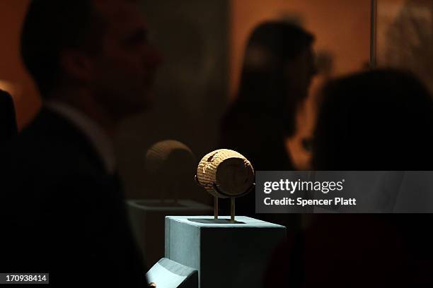 The Cyrus Cylinder-a 2,600-year-old inscribed clay document from Babylon in ancient Iraq-is viewed at the The Metropolitan Museum of Art on June 20,...