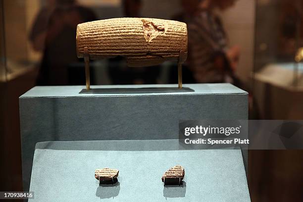 The Cyrus Cylinder-a 2,600-year-old inscribed clay document from Babylon in ancient Iraq-is viewed at The Metropolitan Museum of Art on June 20, 2013...