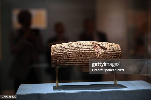 The Cyrus Cylinder-a 2,600-year-old inscribed clay document from Babylon in ancient Iraq-is viewed at The Metropolitan Museum of Art on June 20, 2013...