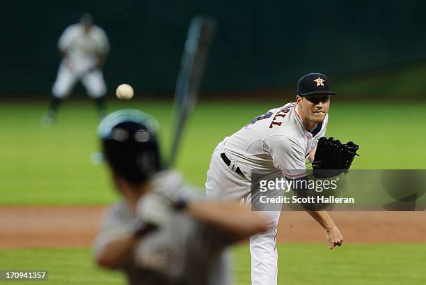 Lucas Harrell of the Houston Astros throws a pitch in the first inning to Logan Schafer of the Milwaukee Brewers at Minute Maid Park on June 20, 2013...