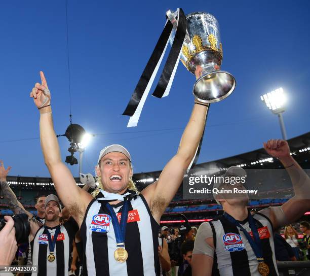 Darcy Moore of the Magpies celebrates winning with the AFL Premiership Cup during the 2023 AFL Grand Final match between Collingwood Magpies and...