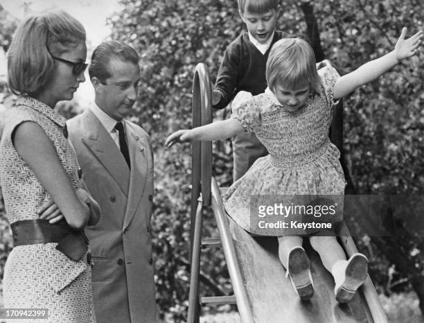 Prince Albert II of Belgium and Princess Paola of Belgium watch two of their three children, Princess Astrid of Belgium and Prince Philippe of...