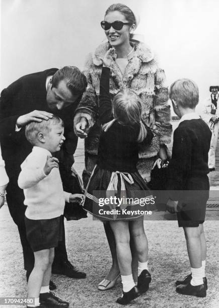 Prince Albert of Belgium, later King Albert II of Belgium Princess Paola of Belgium are met by their children, Prince Laurent of Belgium , Princess...