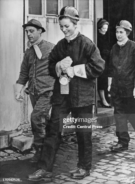 Princess Paola of Belgium wearing a miner's helmet and overalls on a visit to a colliery in Liege, Belgium, 24th March 1961.