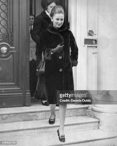 Princess Paola of Belgium leaving the Belgian Embassy to go on a shopping trip in London, 17th March 1964.