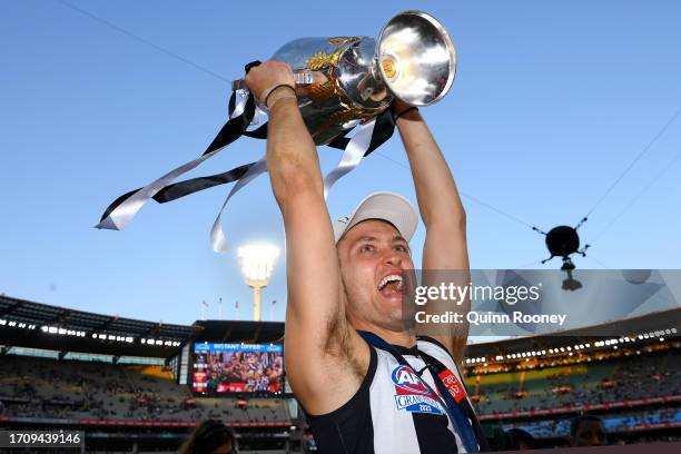 Darcy Moore of the Magpies celebrates winning with the AFL Premiership Cup during the 2023 AFL Grand Final match between Collingwood Magpies and...