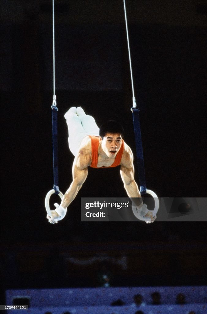 Chinese gymnast Li Ning competes in the men's compulsory exercises at ...