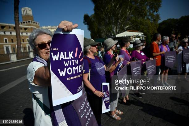 Supporters of Women's Ordination Conference demonstrate to advocate and pray for the ordination of women as deacons, priests, and bishops into an...