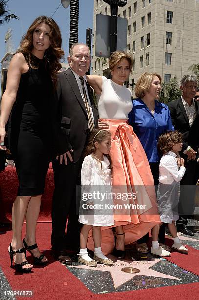 Jennifer Lopez poses with her sister Lynda Lopez, father David Lopez, mother Guadalupe Lopez, daughter Emme Maribel and son Maximilian David as she...