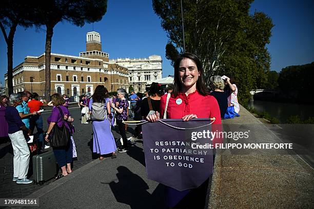 Kate McElwee , President of Women's Ordination Conference , takes part in a demonstration to advocate and pray for the ordination of women as...