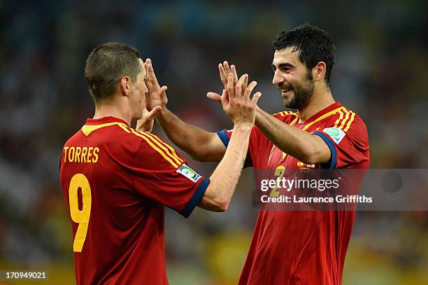 Fernando Torres of Spain celebrates with team-mate Raul Albiol during the FIFA Confederations Cup Brazil 2013 Group B match between Spain and Tahiti...