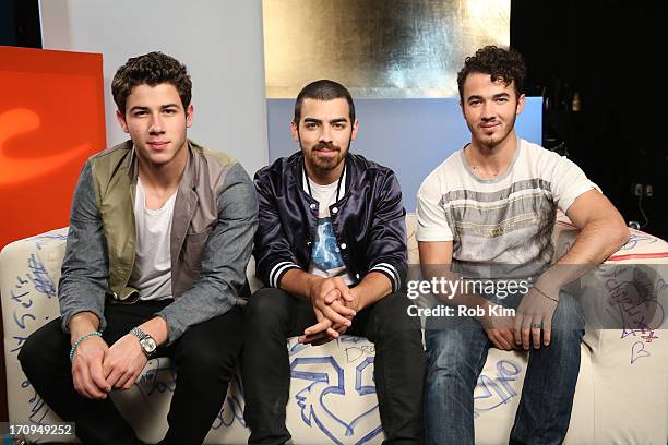 Nick Jonas, Joe Jonas and Kevin Jonas of the Jonas Brothers visit Music Choice's U&A at Music Choice on June 20, 2013 in New York City.