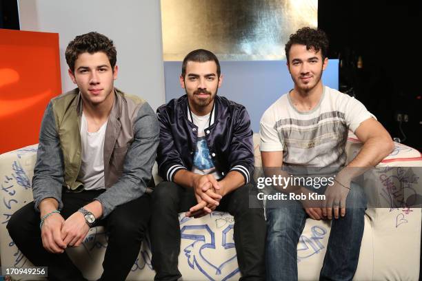 Nick Jonas, Joe Jonas and Kevin Jonas of the Jonas Brothers visit Music Choice's U&A at Music Choice on June 20, 2013 in New York City.