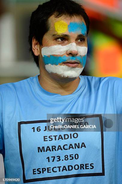Supporter of Uruguay waits for the start of the FIFA Confederations Cup Brazil 2013 Group B football match between Nigeria and Uruguay, at the Fonte...