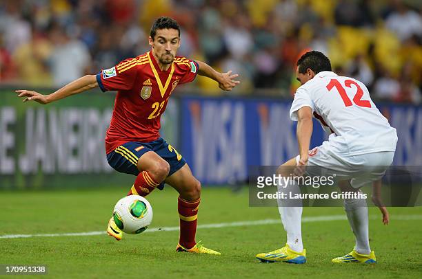 Jesus Navas of Spain competes with Edson Lemaire of Tahiti during the FIFA Confederations Cup Brazil 2013 Group B match between Spain and Tahiti at...