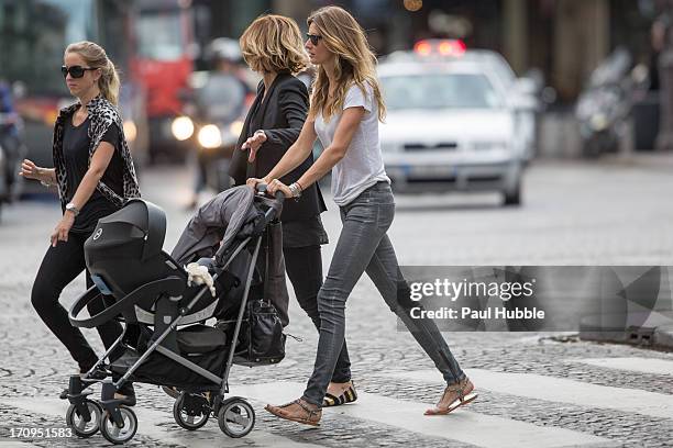 Model Gisele Bundchen and her sister Rafaela Bundchen are sighted on the 'Place Colette' on June 20, 2013 in Paris, France.