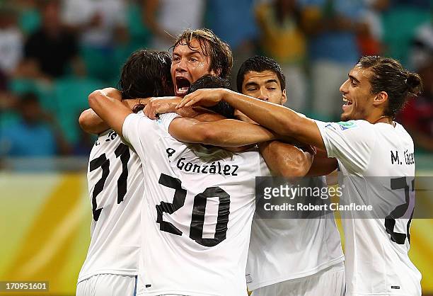 Diego Lugano of Uruguay celebrates with his team-mates after scoring the opening goal during the FIFA Confederations Cup Brazil 2013 Group B match...