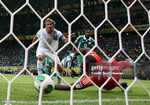 Diego Lugano of Uruguay scores his team's first goal past Vincent Enyeama of Nigeria during the FIFA Confederations Cup Brazil 2013 Group B match...