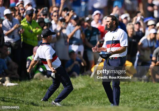 Max Homa and Brian Harman of Team United States celebrate winning their match 4&2 on the 16th green during the Saturday morning foursomes matches of...