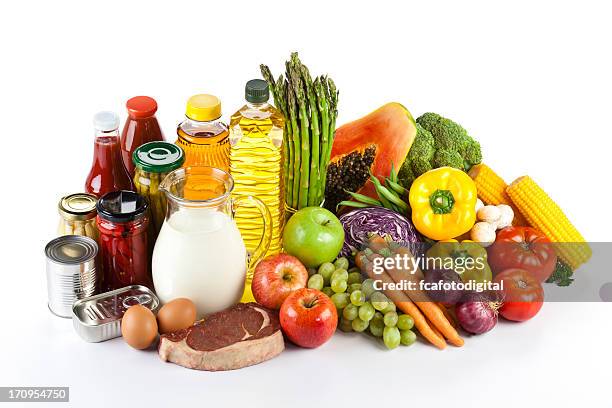 large group of groceries arranged neatly on white table - meat product stock pictures, royalty-free photos & images