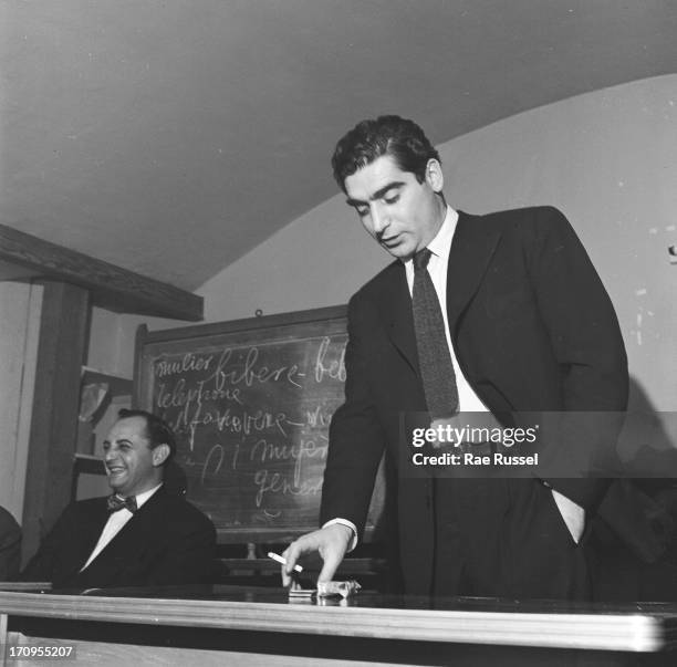 View of the photographer Robert Capa attending a meeting of the American Society of Media Photographers , New York, 1948.