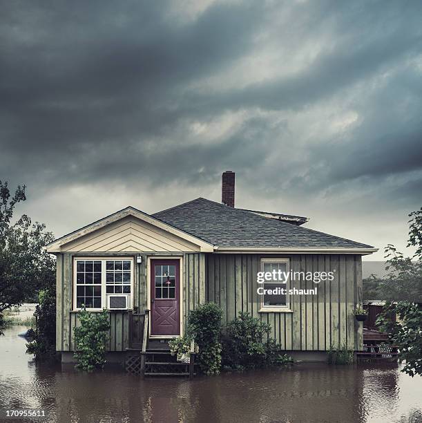 flooded home - flood insurance stock pictures, royalty-free photos & images