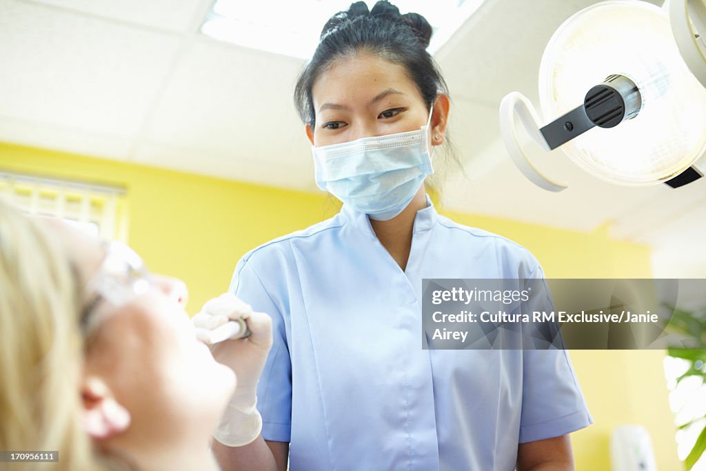 Woman having dental examination