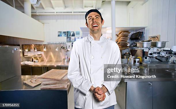 chef smiling to camera - chef portrait stock pictures, royalty-free photos & images