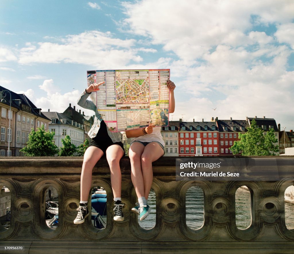 Teenager hidden by city map