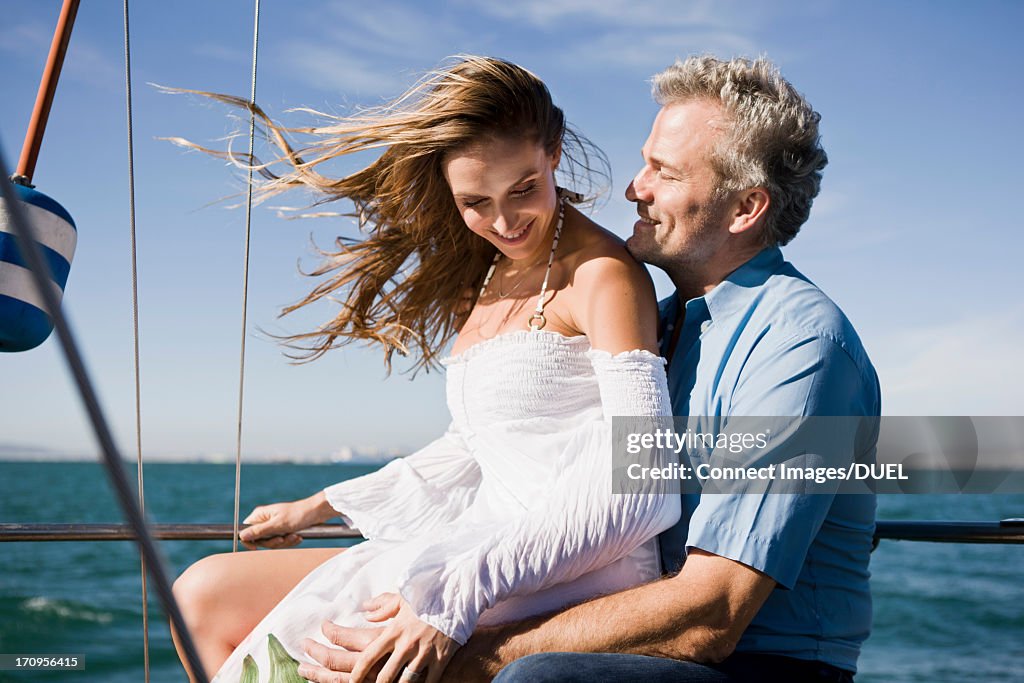 Couple on yacht laughing