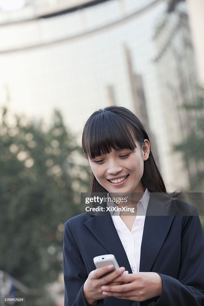 Young Businesswoman texting a message