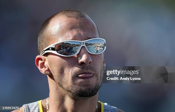 Jeremy Wariner walks off of the track after finishing last in the opening round of the Mens' 400 Meter on day one of the 2013 USA Outdoor Track &...