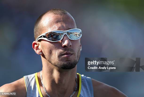 Jeremy Wariner walks off of the track after finishing last in the opening round of the Mens' 400 Meter on day one of the 2013 USA Outdoor Track &...