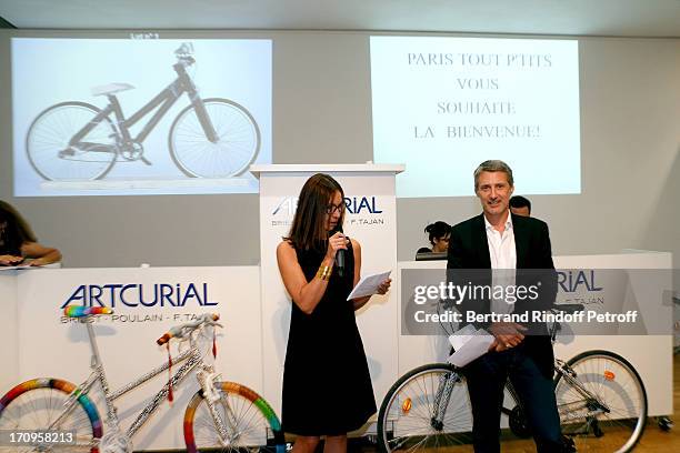 Ariane Poniatowski and auctioneer Francois Tajan attend 'Arty Bike' Auction to benefit Association des Tout P'tits at Artcurial on June 20, 2013 in...