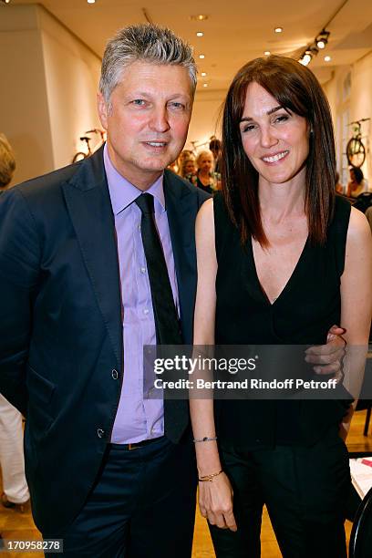 Auctioneer Francois Tajan and his wife Veronique attend 'Arty Bike' Auction to benefit Association des Tout P'tits at Artcurial on June 20, 2013 in...