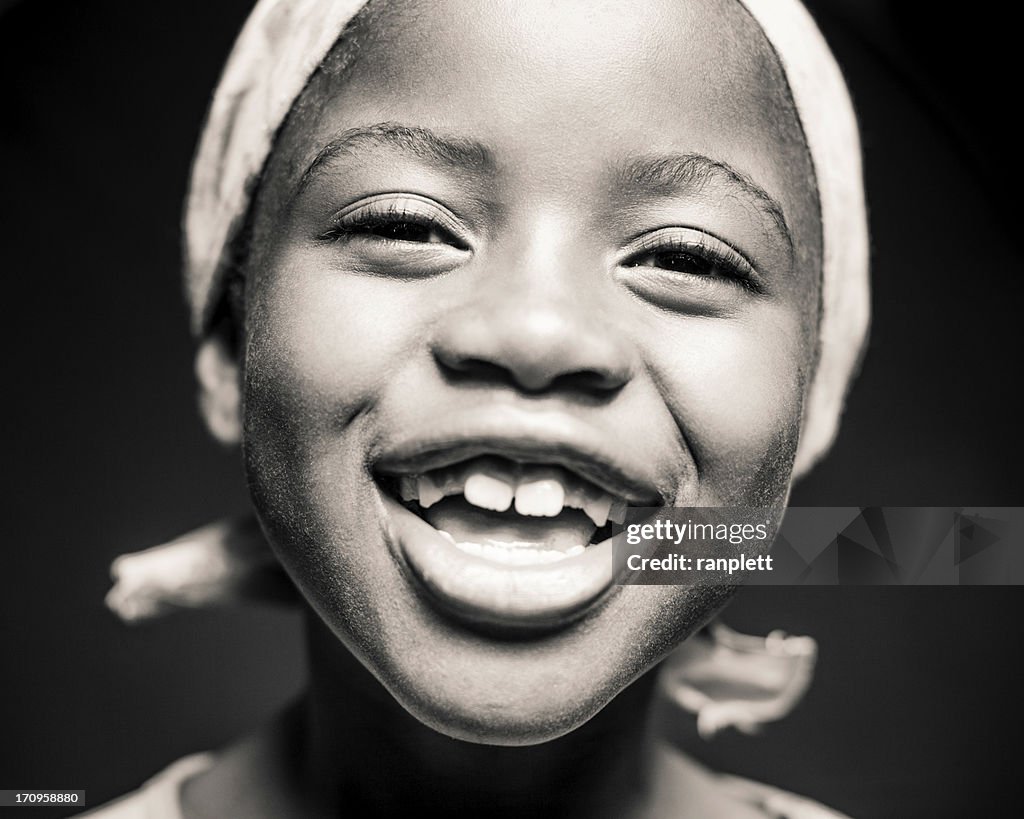 Young African Girl Laughing (Isolated on Black)