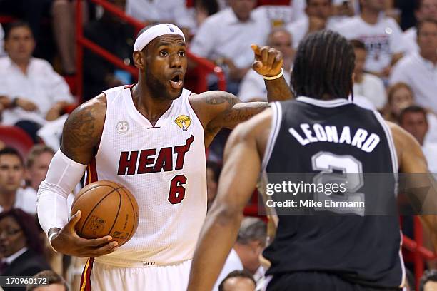 LeBron James of the Miami Heat calls a play against Kawhi Leonard of the San Antonio Spurs in the first quarter during Game Seven of the 2013 NBA...