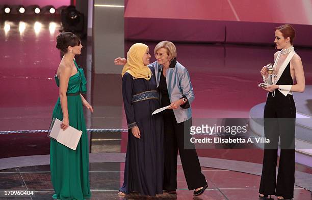 Alaa Murabit receives Bellisario award from Foreign Minister Emma Bonino during the Premio Bellisario 2013 at Dear RAI studios on June 20, 2013 in...