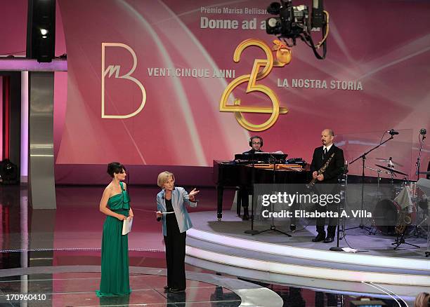 Presenter Lorena Bianchetti and Foreign Minister Emma Bonino attend Premio Belisario 2013 at Dear RAI studios on June 20, 2013 in Rome, Italy.