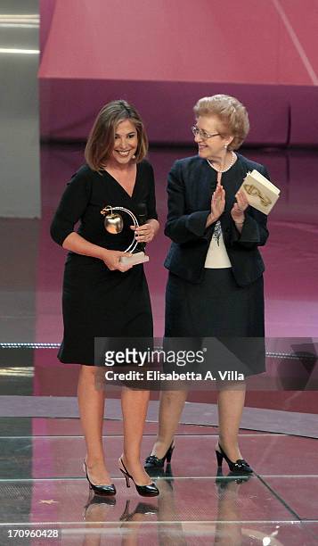 Italian journalist Maria Latella receives Bellisario award from RAI President Anna Maria Tarantola attend Premio Bellisario 2013 at Dear RAI studios...