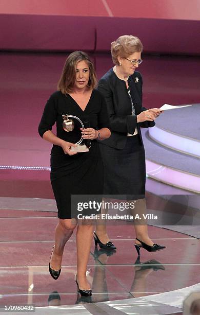 Italian journalist Maria Latella receives Bellisario award from RAI President Anna Maria Tarantola attend Premio Bellisario 2013 at Dear RAI studios...