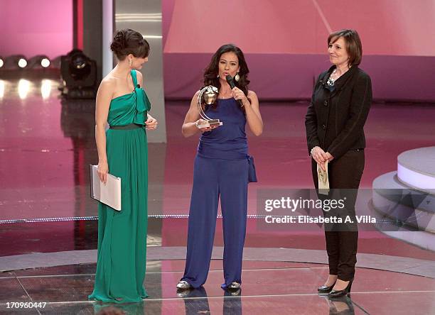 Giuseppina Versace receives Bellisario award from Sabrina De Camillis during the Premio Bellisario 2013 at Dear RAI studios on June 20, 2013 in Rome,...