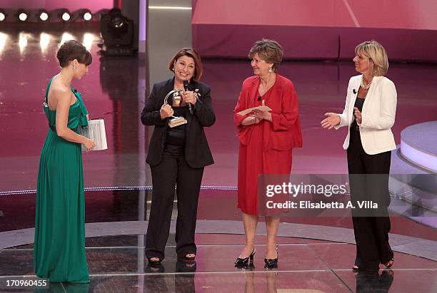 Maria Bianca Farina receives Bellisario award from Donatella Treu and Linda Lanzillotta during the Premio Bellisario 2013 at Dear RAI studios on June...