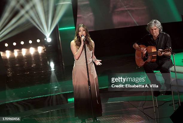 Phil Palmer and singer Paris performe during the Premio Bellisario 2013 at Dear RAI studios on June 20, 2013 in Rome, Italy.