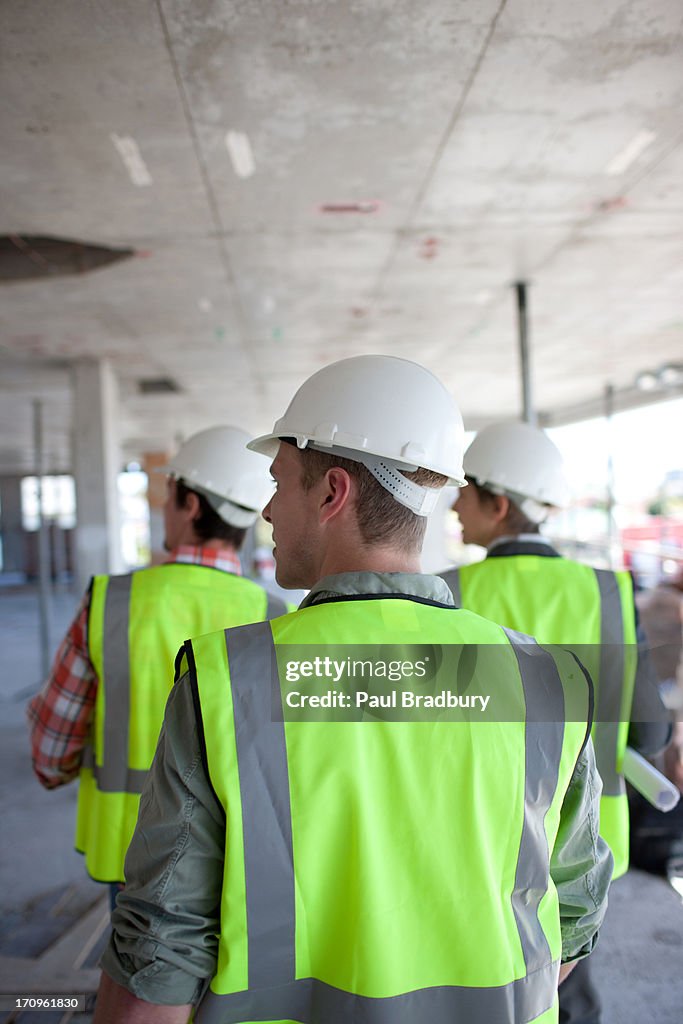 Construction workers walking on construction site