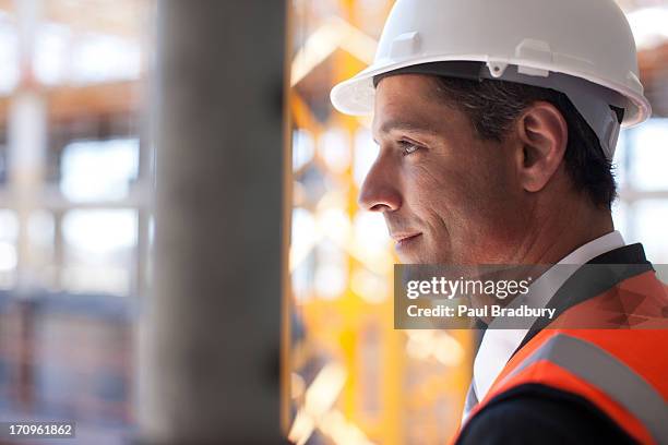 businessman on construction site - architekt helm plan stock pictures, royalty-free photos & images