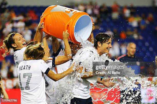 Abby Wambach of the USA gets a Gatorade bath by her teamates after a 5-0 win against Korea Republic after Wambach broke Mia Hamm's alltime...
