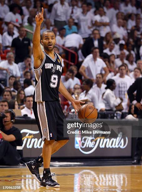 Tony Parker of the San Antonio Spurs calls a play in the third quarter while taking on the Miami Heat during Game Seven of the 2013 NBA Finals at...