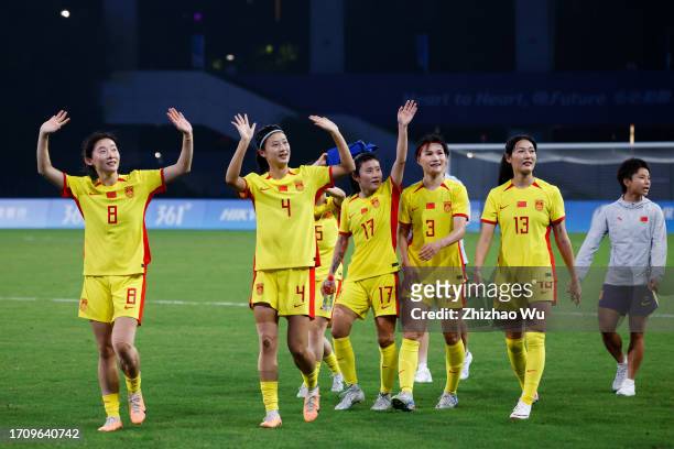 Players of China thank the fans after the 19th Asian Games Women Group A match between Uzbekistan and China at Linping Sports Centre Stadium on...